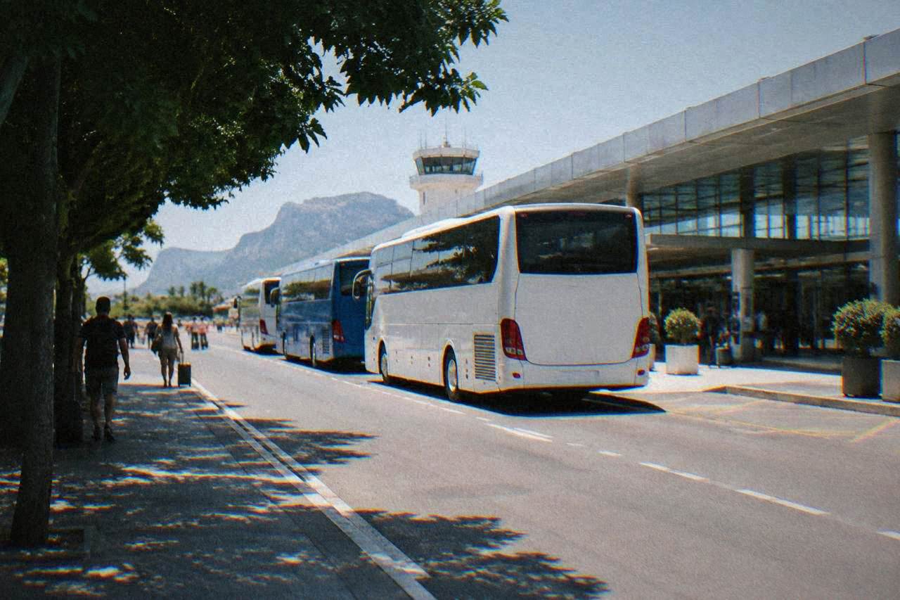 Buses parked at the arrivals kerb outside Palermo Falcone Borsellino airport terminal