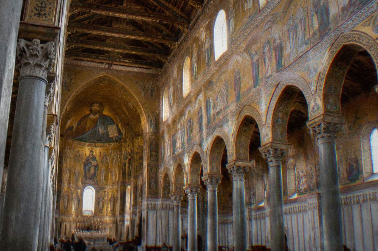 Interior of Monreale Cathedral with gold mosaic decoration covering the walls above the nave