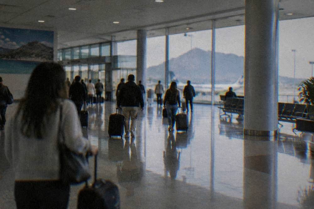 The interior of Palermo airport arrivals hall with travellers and luggage