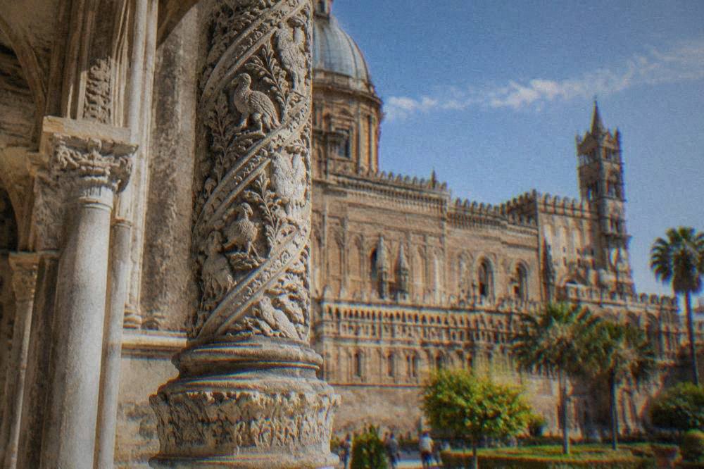 A tall carved column on the southern porch of Palermo Cathedral seen up close in afternoon light