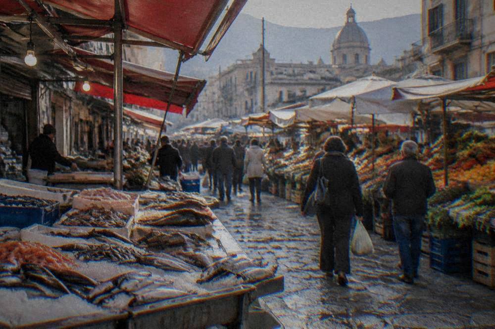 Stalls of a Palermo street market with produce, fish and crowds of shoppers