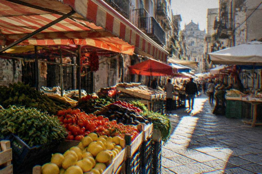 Market stall with fresh produce and awnings in BallarÃ², Palermo
