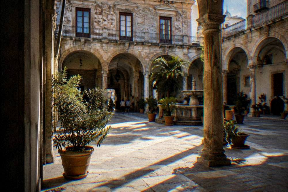 Courtyard and arcades of a historic palazzo in Palermo
