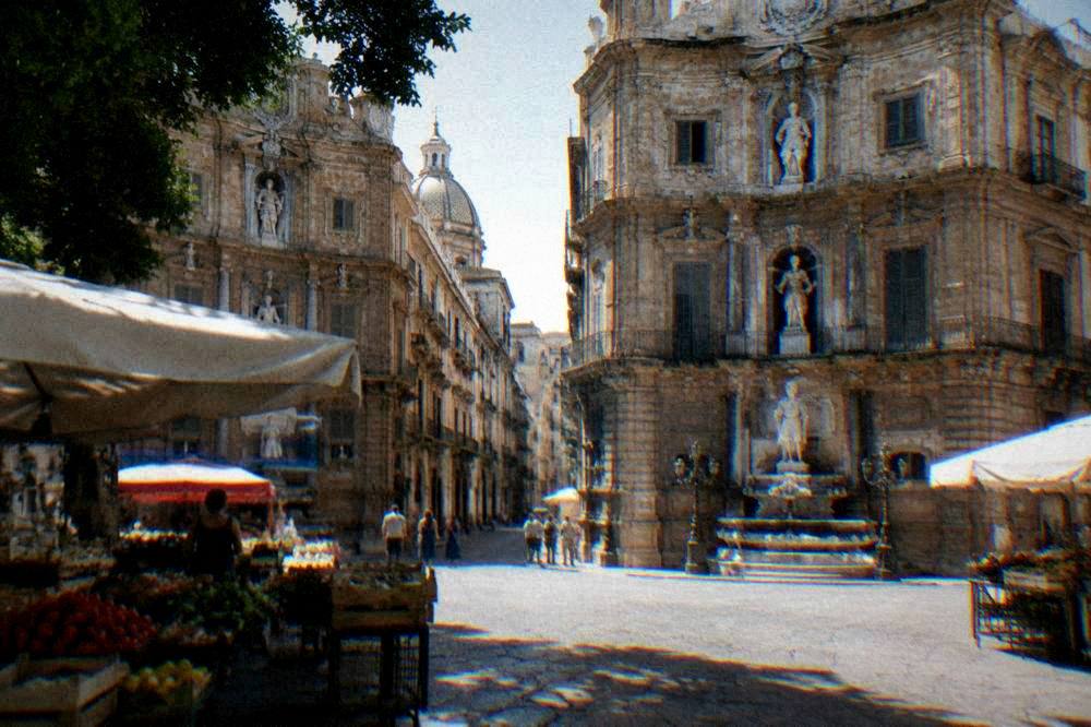 The corner of the Quattro Canti square in Palermo with its ornate facades and fountains