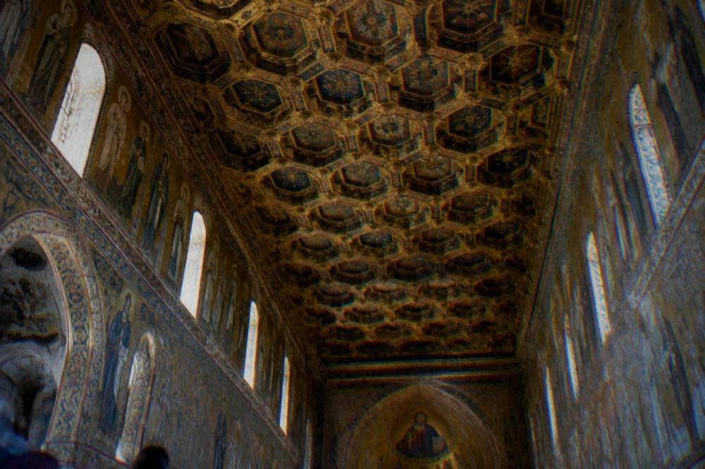 A painted wooden honeycomb ceiling seen from below in the Palatine Chapel