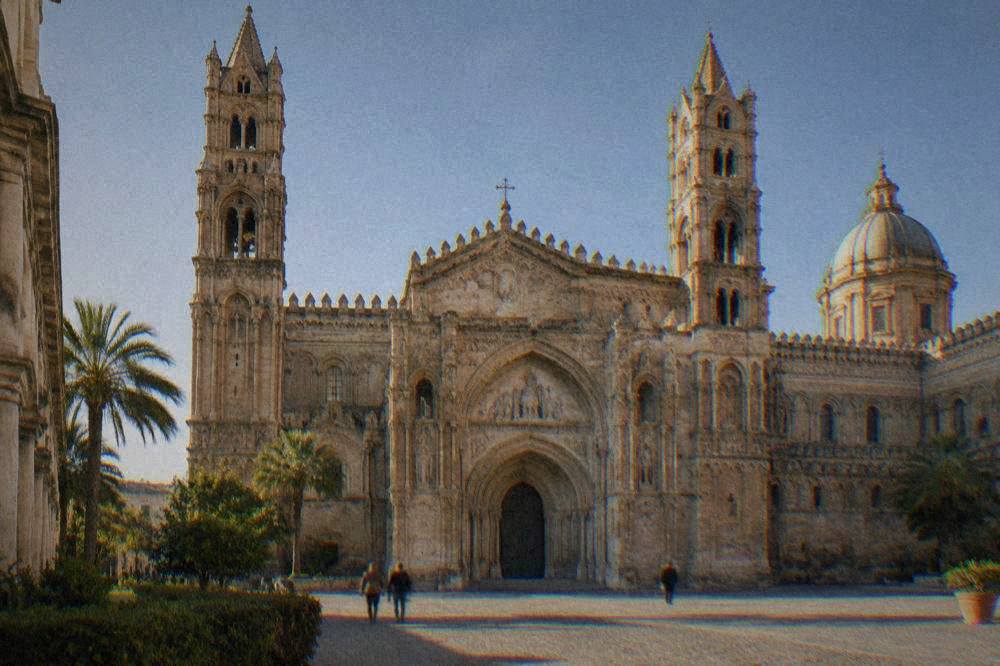 The twin towers and central portal of the cathedral facade on a clear morning