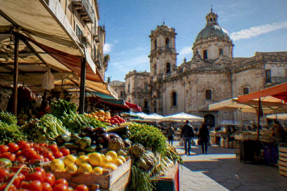 A market stall with fruit and vegetables in the BallarÃ² market a short walk from San Cataldo