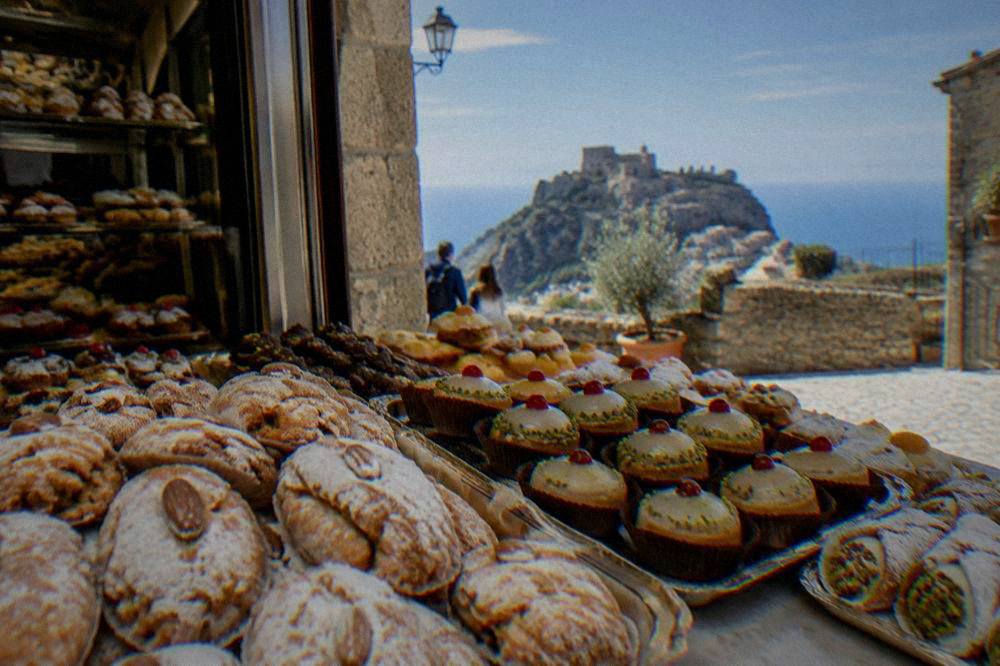 Almond pastries and small cakes displayed in a traditional Sicilian pastry shop