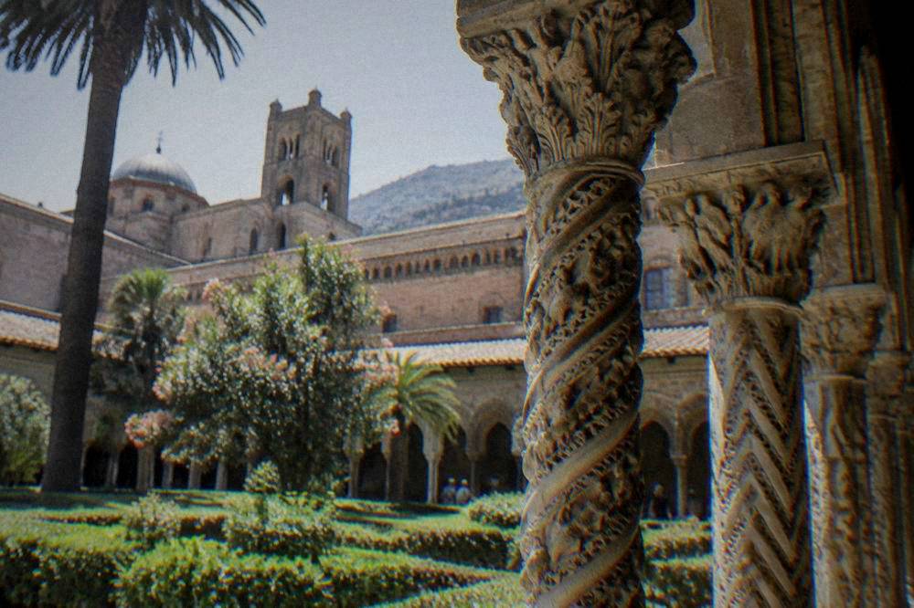 Carved twin columns of the Monreale cloister around the garden
