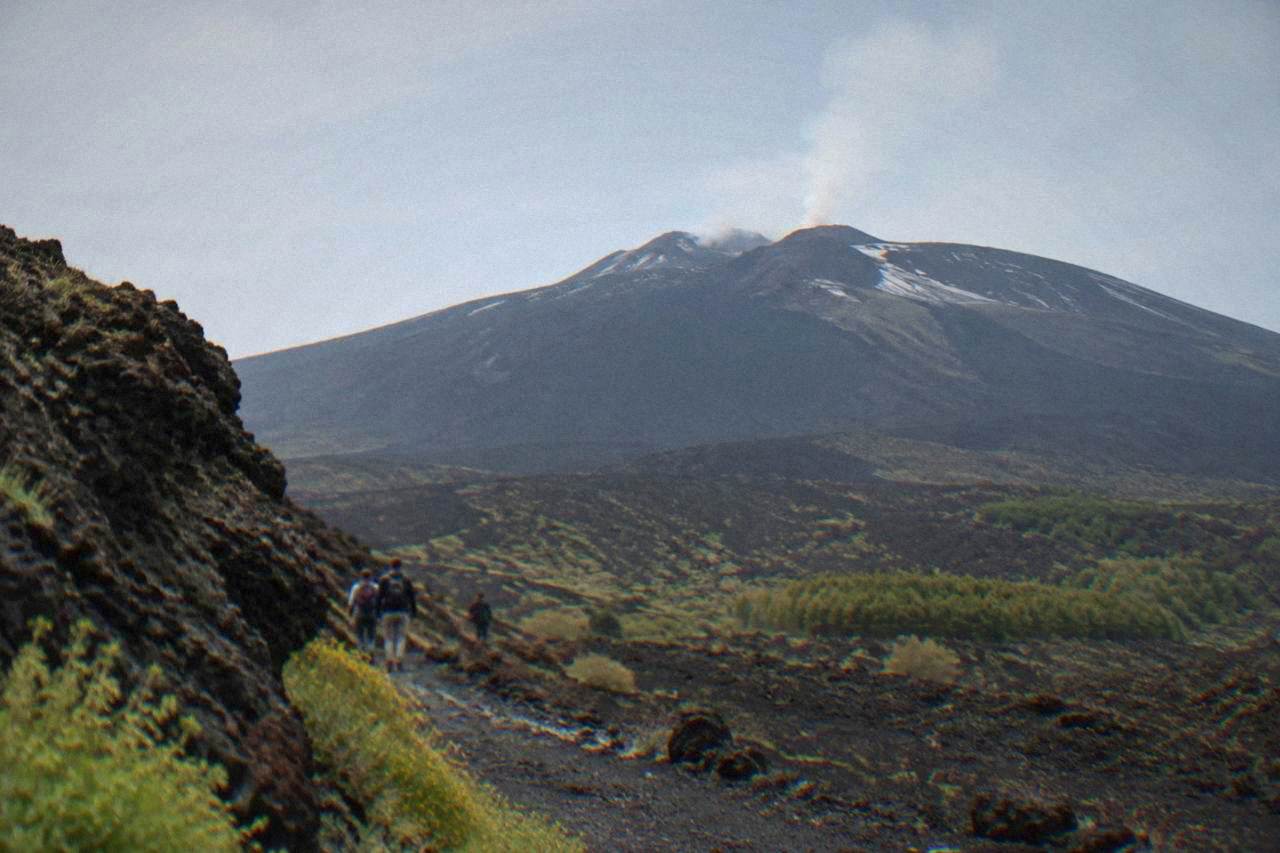 The dark volcanic slopes of Mount Etna rising above Sicily under a clear sky