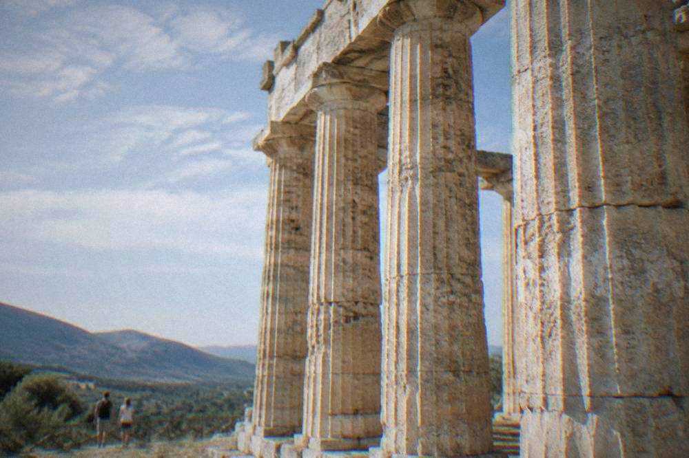 Close view of fluted Doric stone columns of the Segesta temple against blue sky