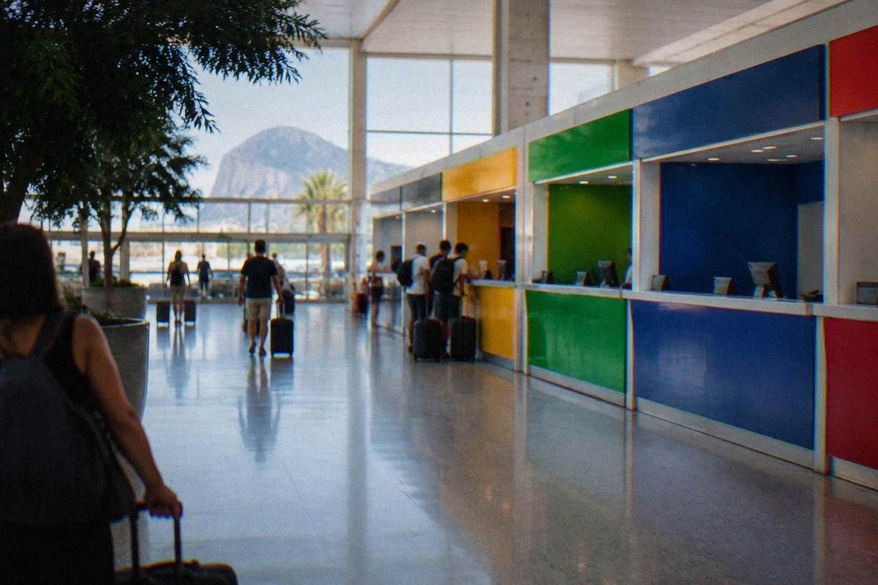 Rental car counters inside the arrivals hall of Palermo Falcone Borsellino airport