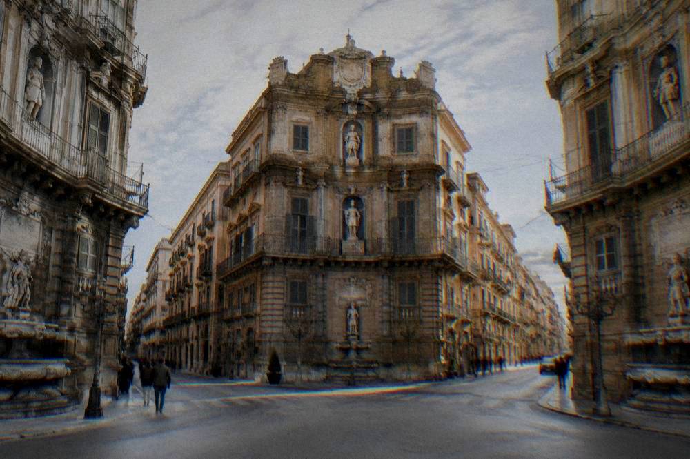 The ornate crossroads of the Quattro Canti in Palermo seen from street level