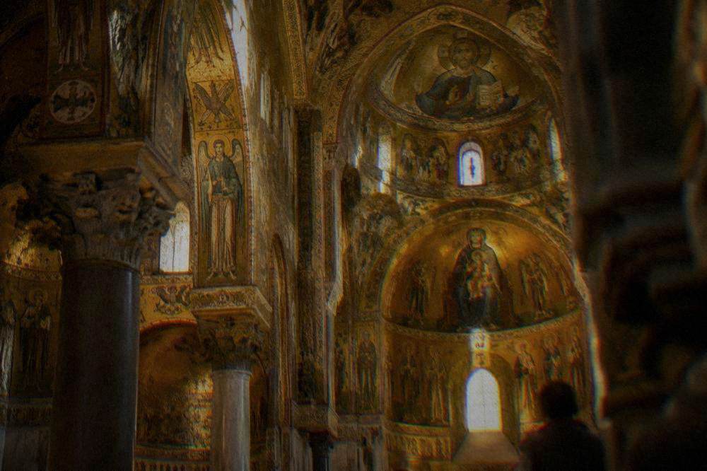 Golden mosaic interior of the Palatine Chapel ceiling glowing under warm light