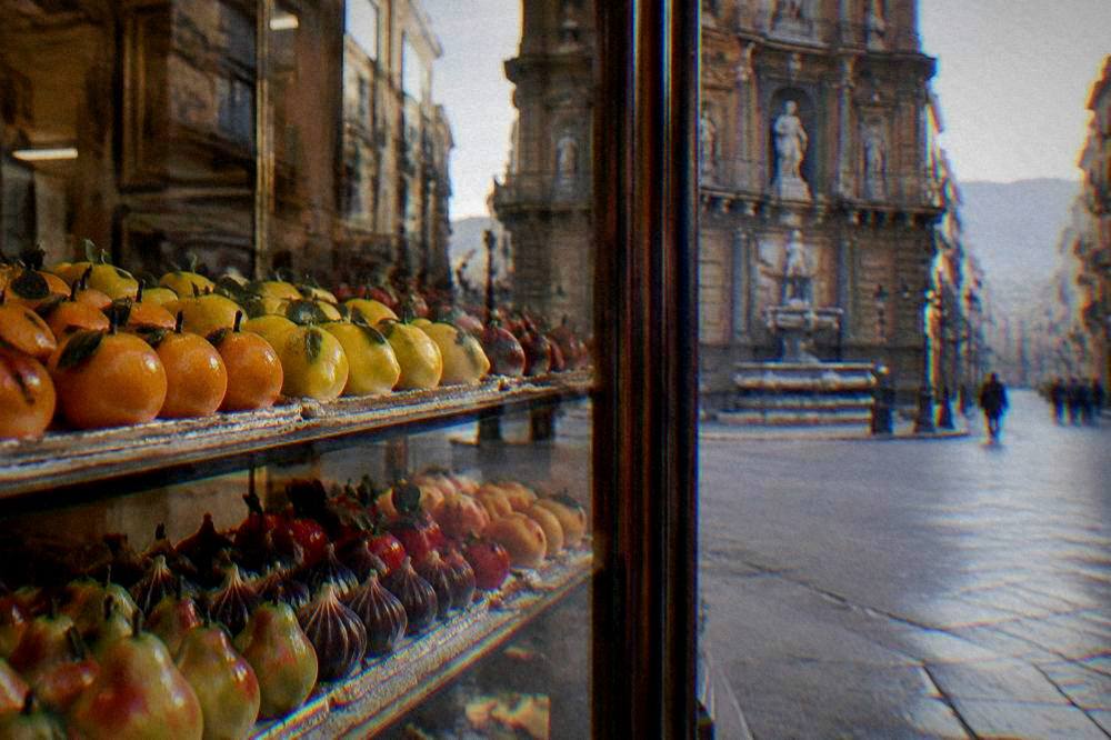 Painted almond paste fruits arranged in rows in a Palermo confectionery window