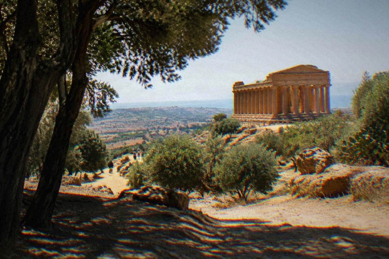 Ancient Greek temple columns standing on a ridge above the countryside near Agrigento