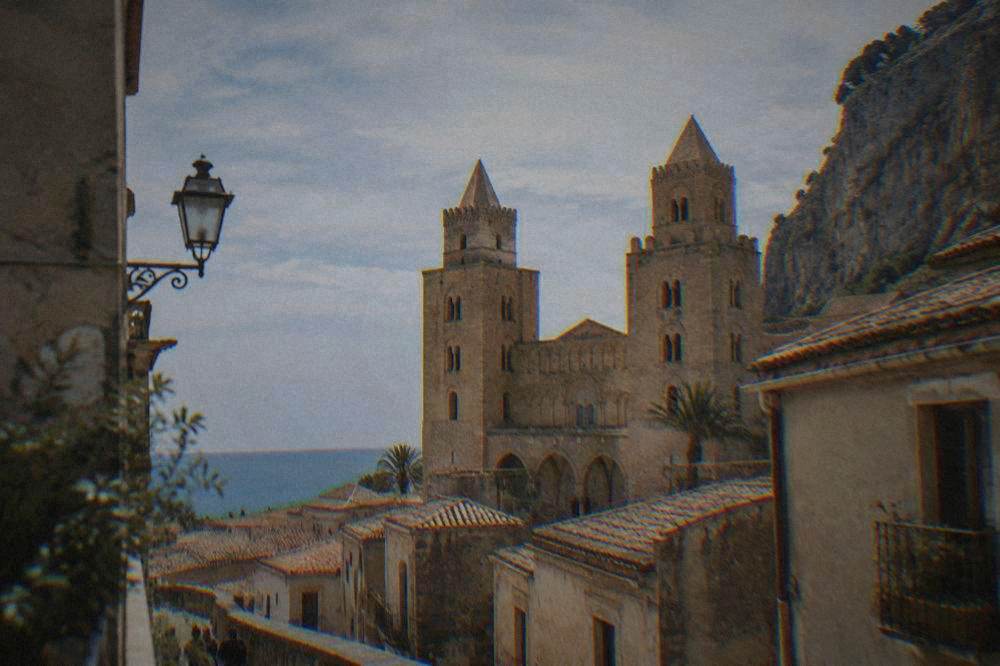 Twin towers of Cefalu cathedral rising above the roofs of the old town