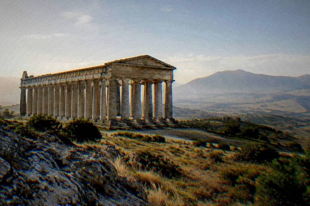 The Doric temple at Segesta standing on its hillside above the Sicilian countryside