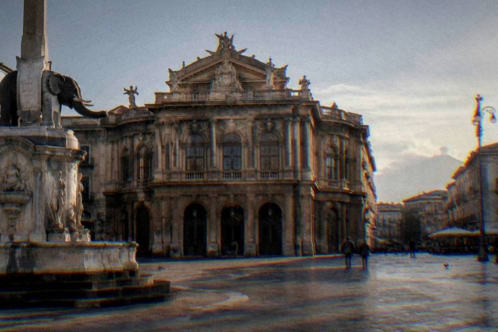 Historic opera house facade in a Sicilian square in late afternoon light