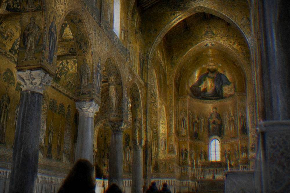 The interior of the Palatine Chapel with gold mosaics covering walls and ceiling