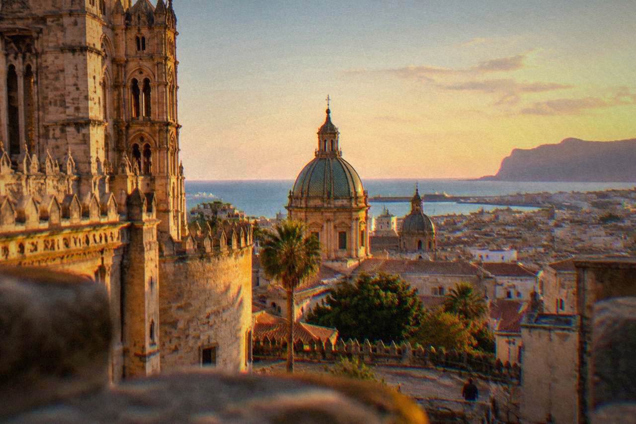 The domes and rooftops of Palermo seen from the cathedral area toward the Tyrrhenian Sea