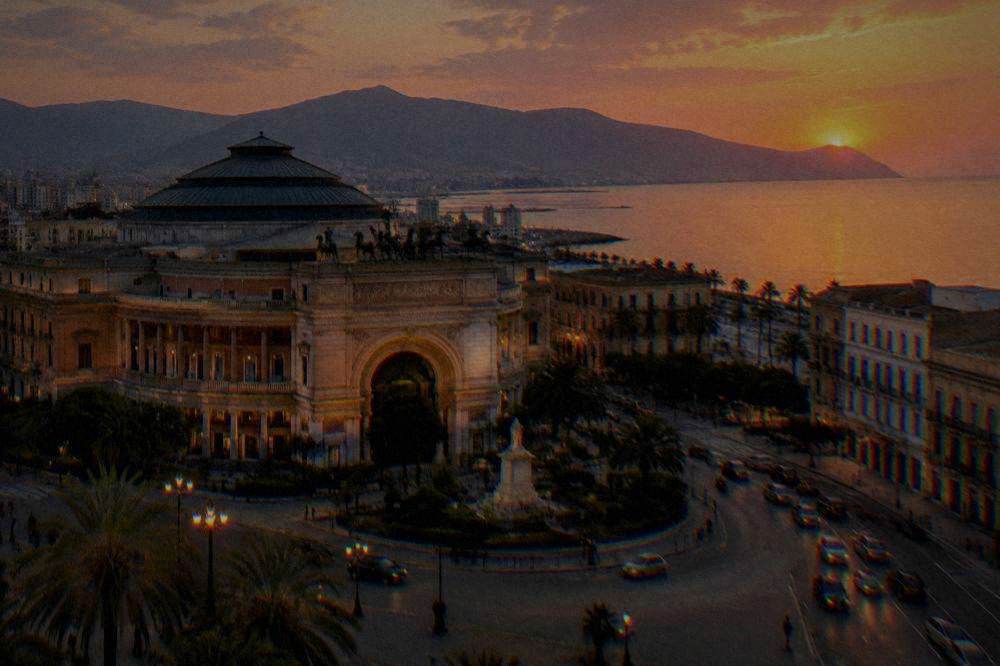 The ornate theatre building at Politeama with the evening traffic circling around it
