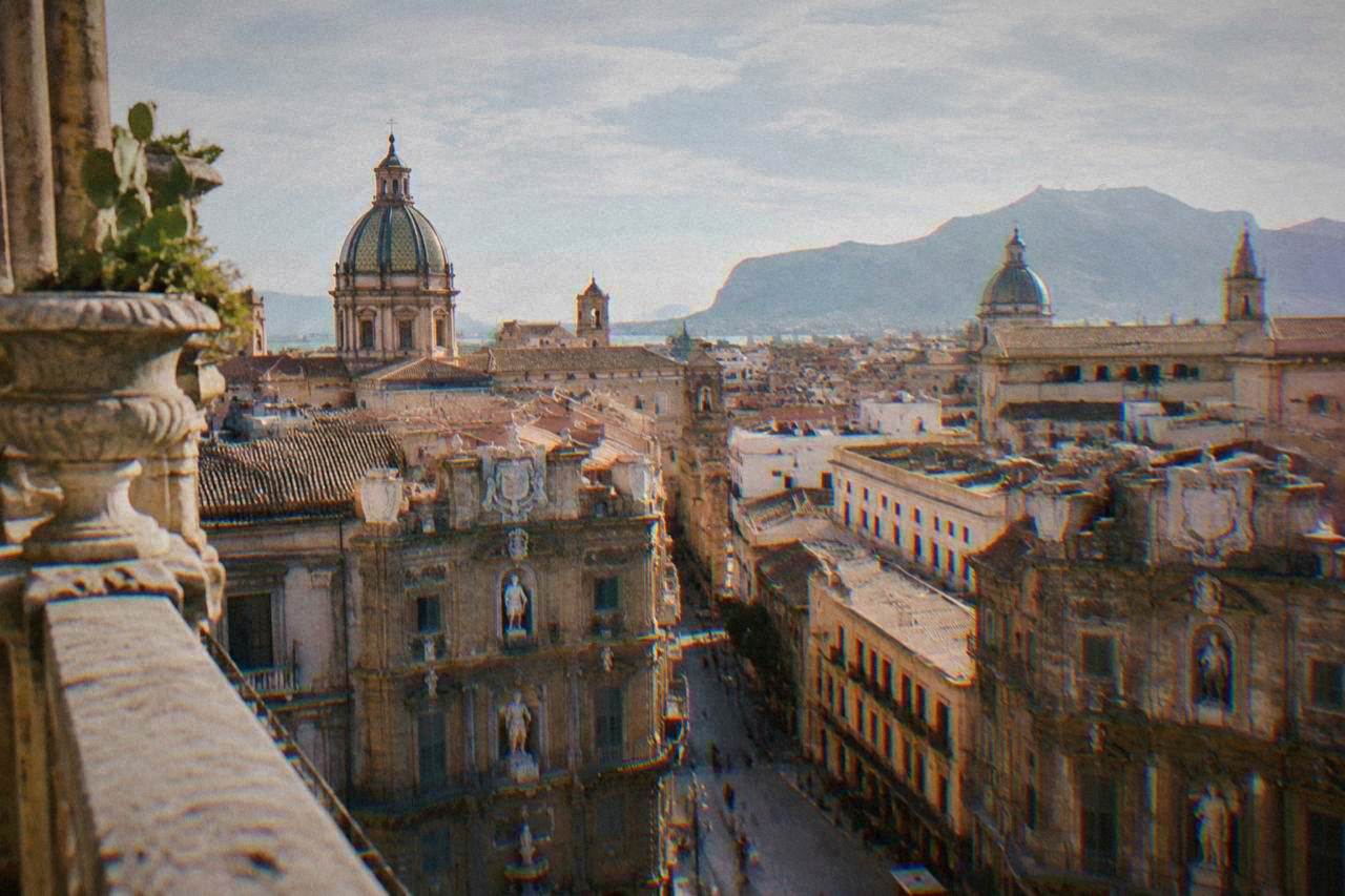 The domes and rooftops of central Palermo seen from a high terrace