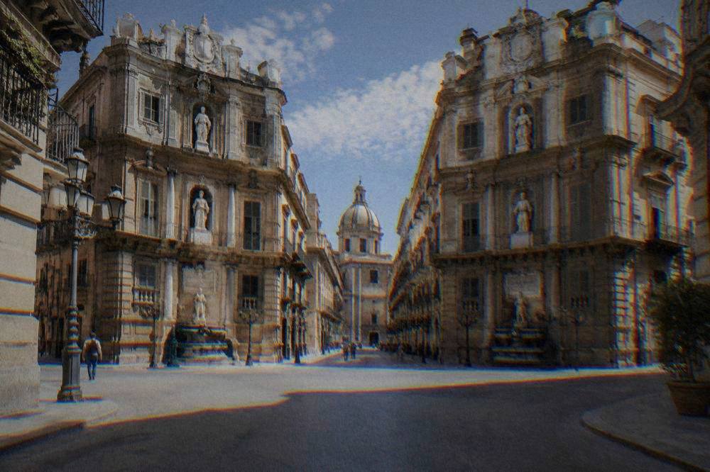 The ornate corner facades of the Quattro Canti crossing in Palermo at midday