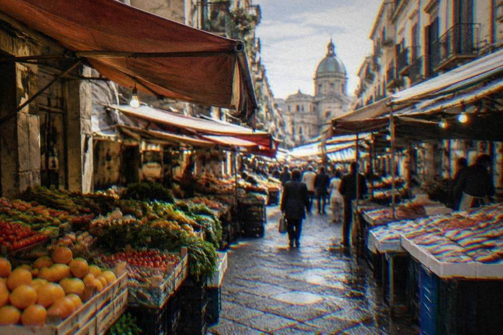 Narrow market street in central Palermo with stalls and shoppers under hanging awnings
