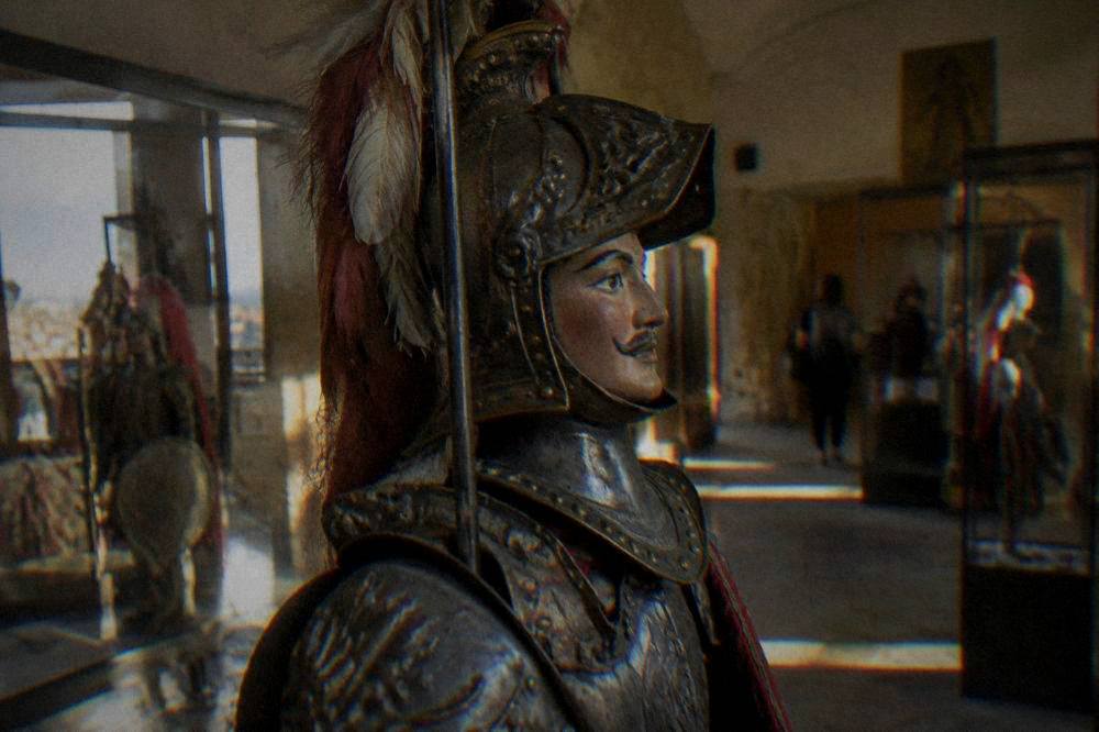 Sicilian puppet on display in a puppet museum with traditional armour and colours